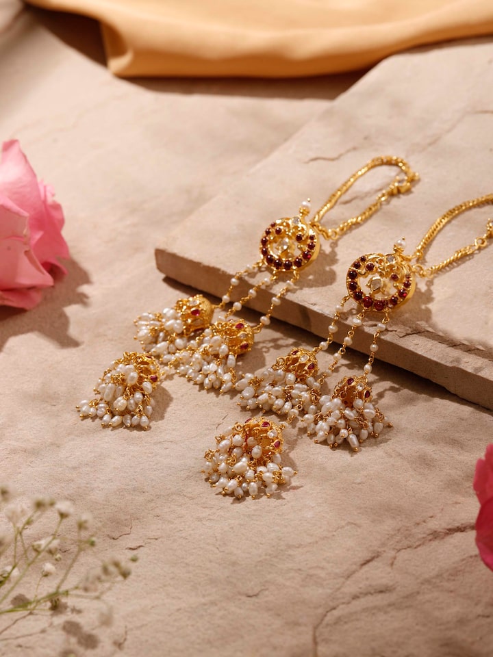 Overhead view of Guttapusalu silver drop earrings revealing symmetrical design and heritage styling