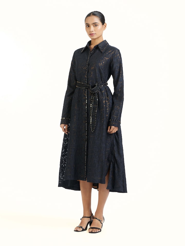 Side view of black handloom cut work dress highlighting elegant silhouette