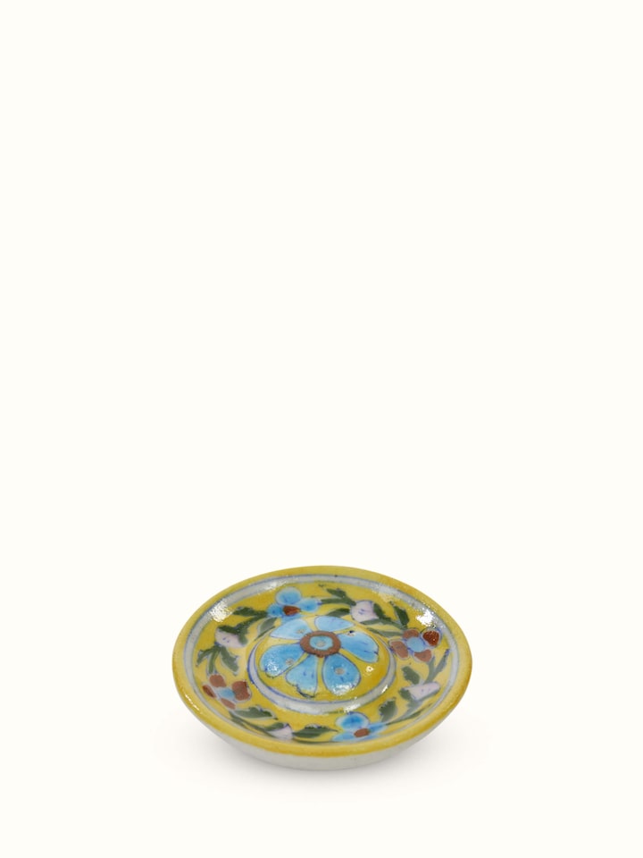 Top view of yellow blue pottery ceramic incense stick holder