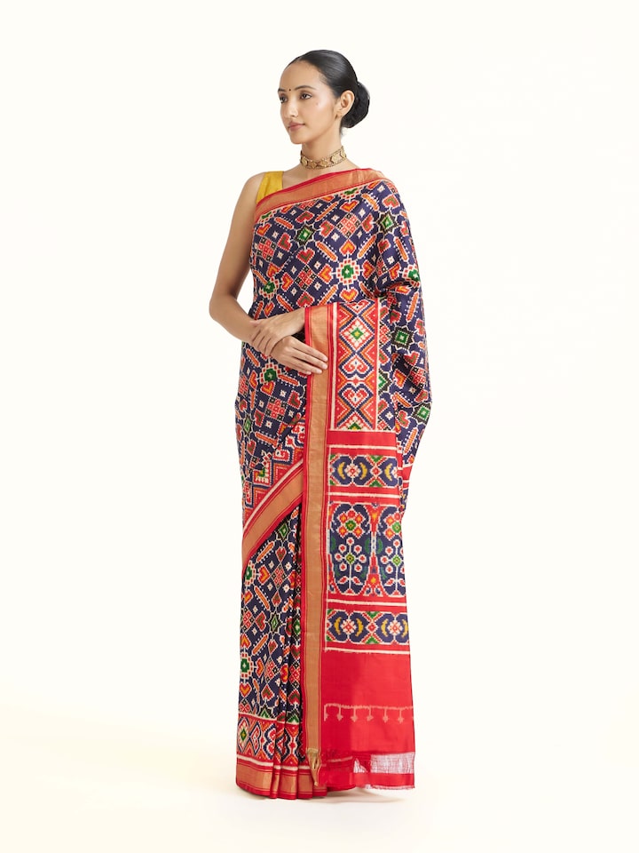 side view of navy double ikat silk saree drape