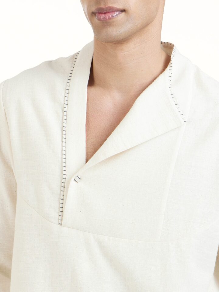 Detail view of ivory cotton handloom short kurta showing handwoven cotton