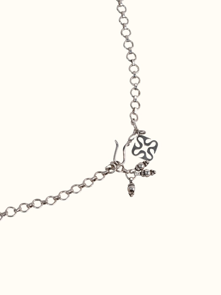 Detail shot of silver smithing collar necklace