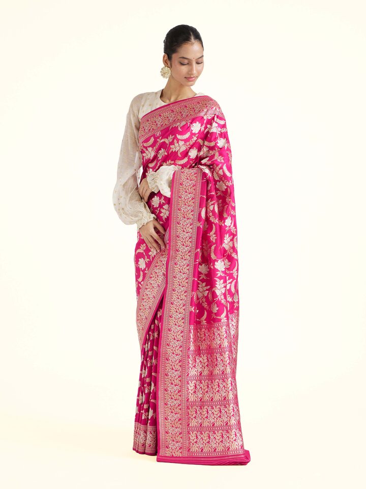 Side view of pink silk Banarasi saree with graceful drape and traditional border