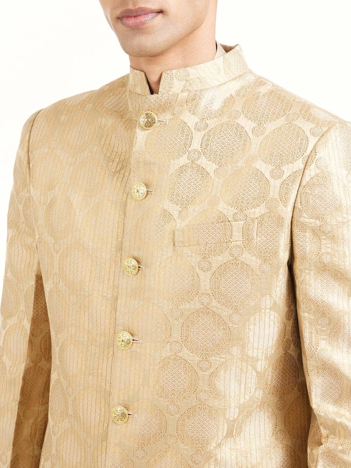 Detail view of beige silk traditional butidar Banarasi handloom brocade men’s sherwani showing fabric texture