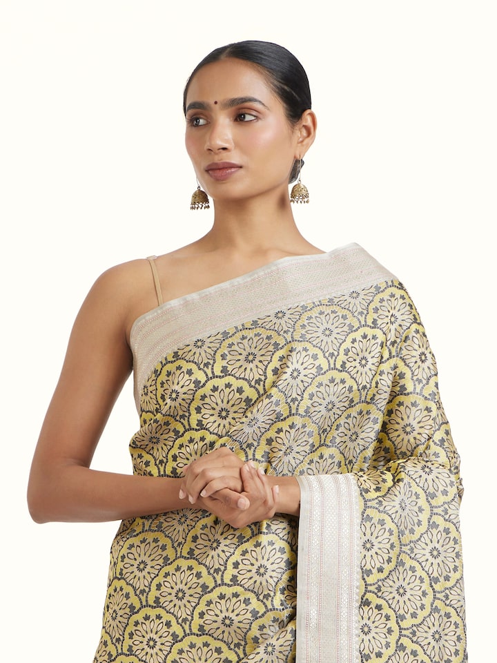 angled view of yellow banarasi brocade saree