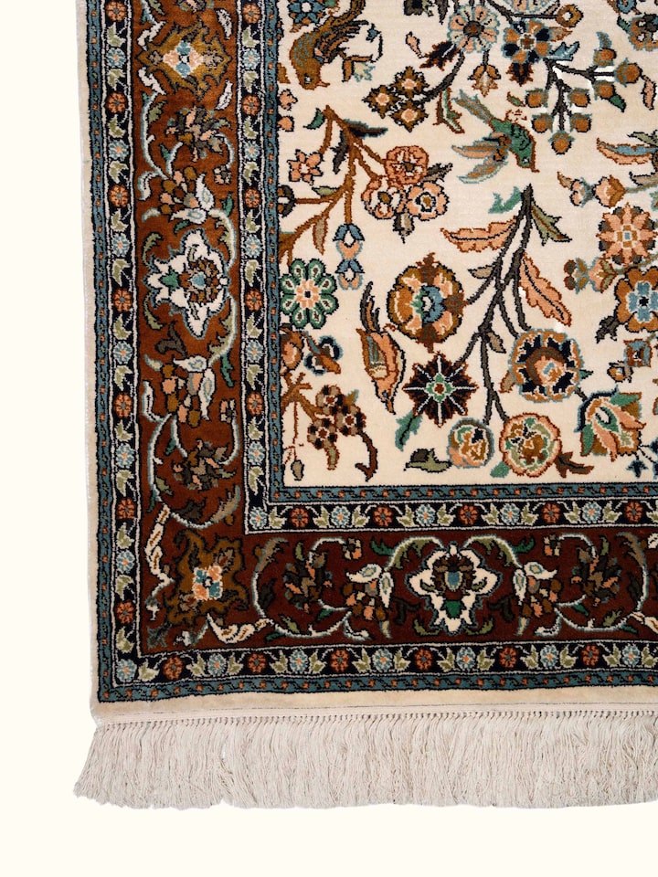 Detail view of Traditional Persian Ivory Mahal Kashmir Silk Hand-Knotted Carpet highlighting the intricate pattern and pile texture