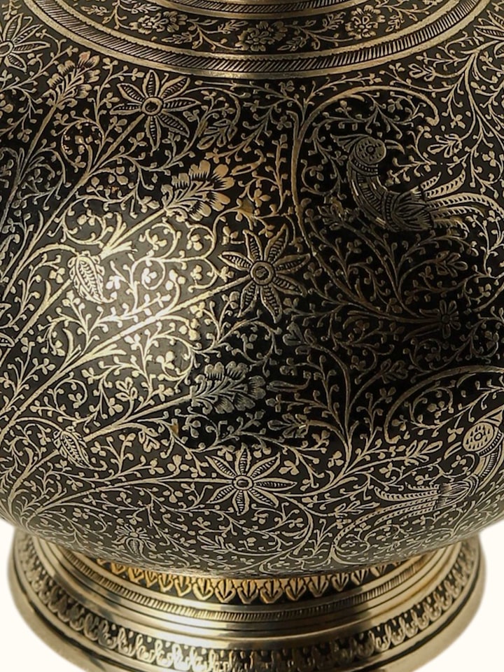 detail view of brassware table vase pattern