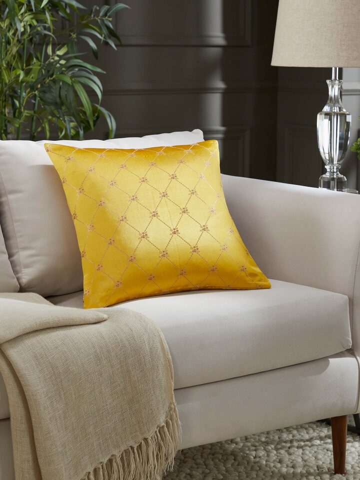 Lifestyle view of Awadh Yellow Banarasi Cushion Cover on a sofa, enhancing the space with regal charm and handloom elegance.