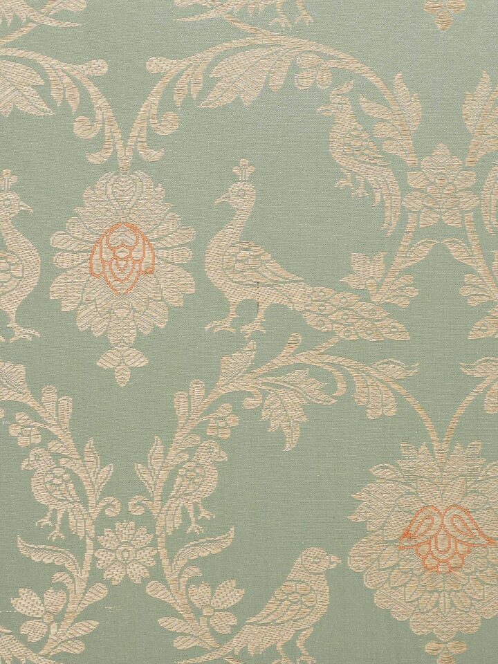 Detail shot 1: Close-up of silk jaal work showcasing handwoven detailing on pista green fabric.