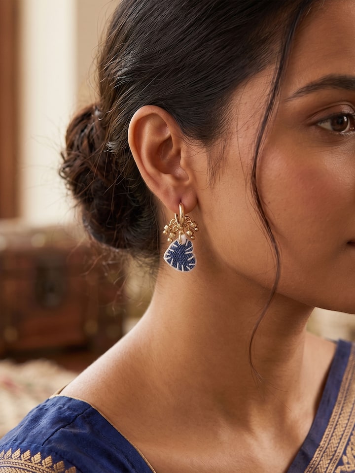 Styled view of Upcycled Drop Earrings worn on the ear, showing how it looks styled
