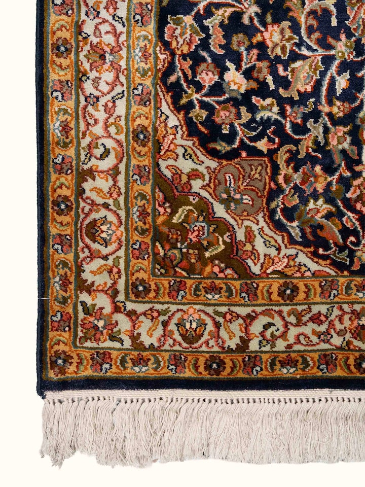 Detail view of Traditional Persian Navy Green Kashan Kashmir Silk Hand-Knotted Carpet highlighting the intricate pattern and pile texture