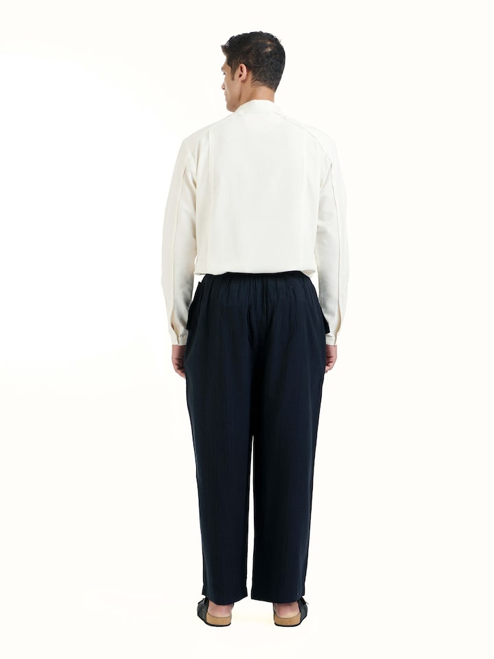 Back view of black silk handloom straight pants with neat fit and finish