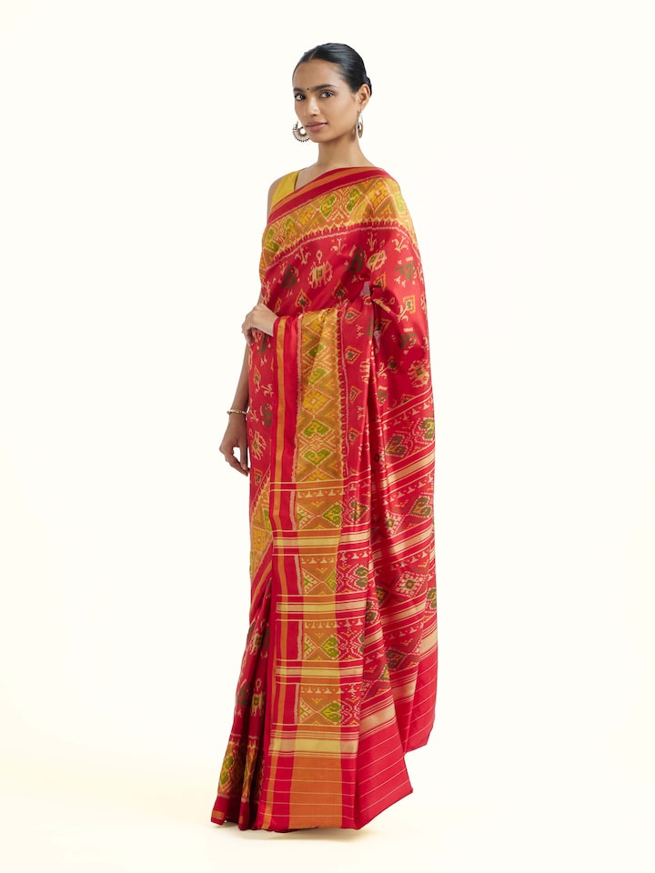 Side view of Rajkot Patola Ikat Saree highlighting the detailed craftsmanship and elegant silhouette