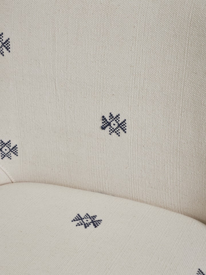 Detailed view of Upholstered Metal Bar Chair emphasizing the fine stitching and luxurious upholstery finish.