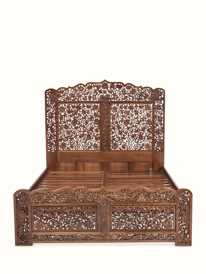 Front view of Carved Walnut Wood Queen-size Bed showing the ornate headboard and footboard
