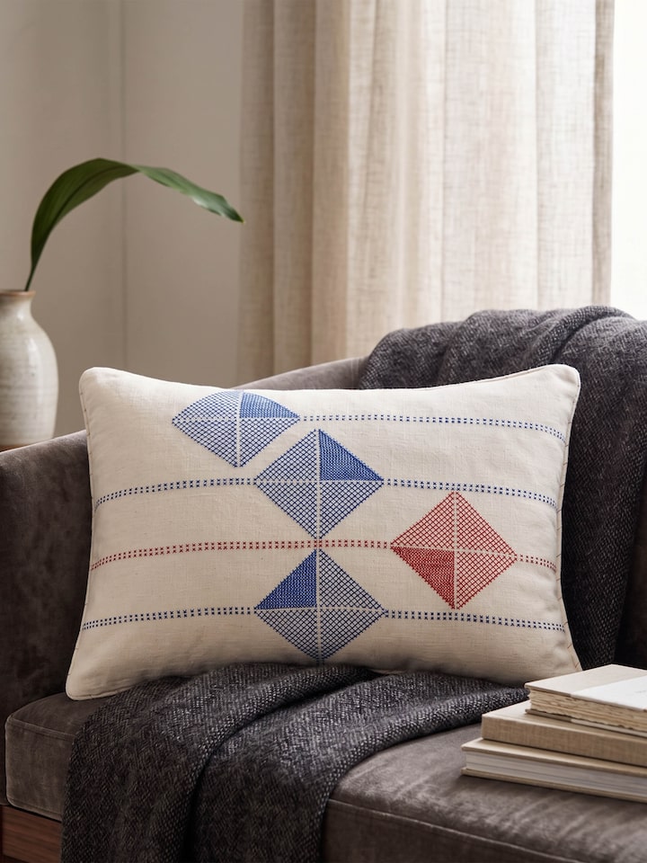 Lifestyle view of the Swadesh Uttarayan Hand Embroidery Kutch Jat Cotton Cushion Cover