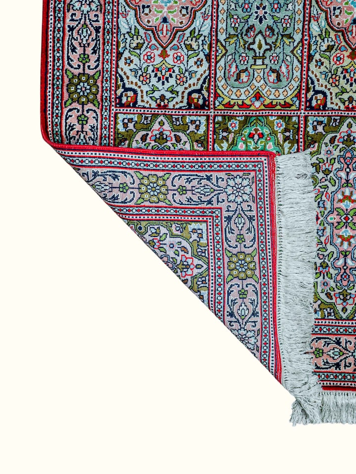 Side-angle view of the Traditional Persian Green Gum Kashmir Silk Hand-Knotted Carpet