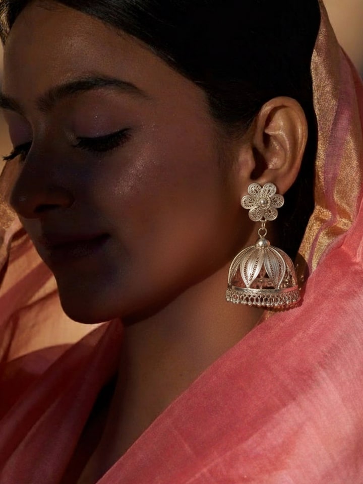 Styled view of Silver Smithing Jhumkas worn on the ear, showing how it looks styled