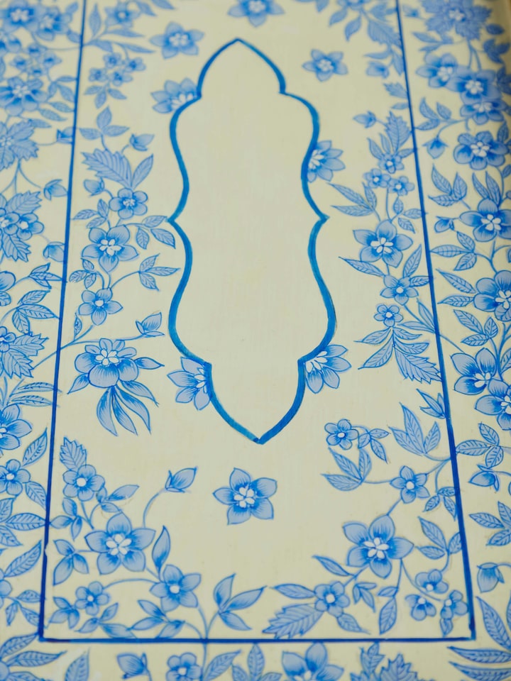 Papier-mache decorative tray in multicolor with detailed traditional artwork.