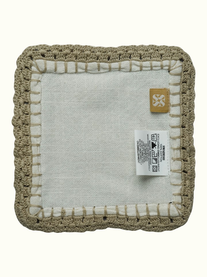 Back view of Nityam Ivory Cotton Slub Crochet Coasters Set Of 6 showing the reverse side