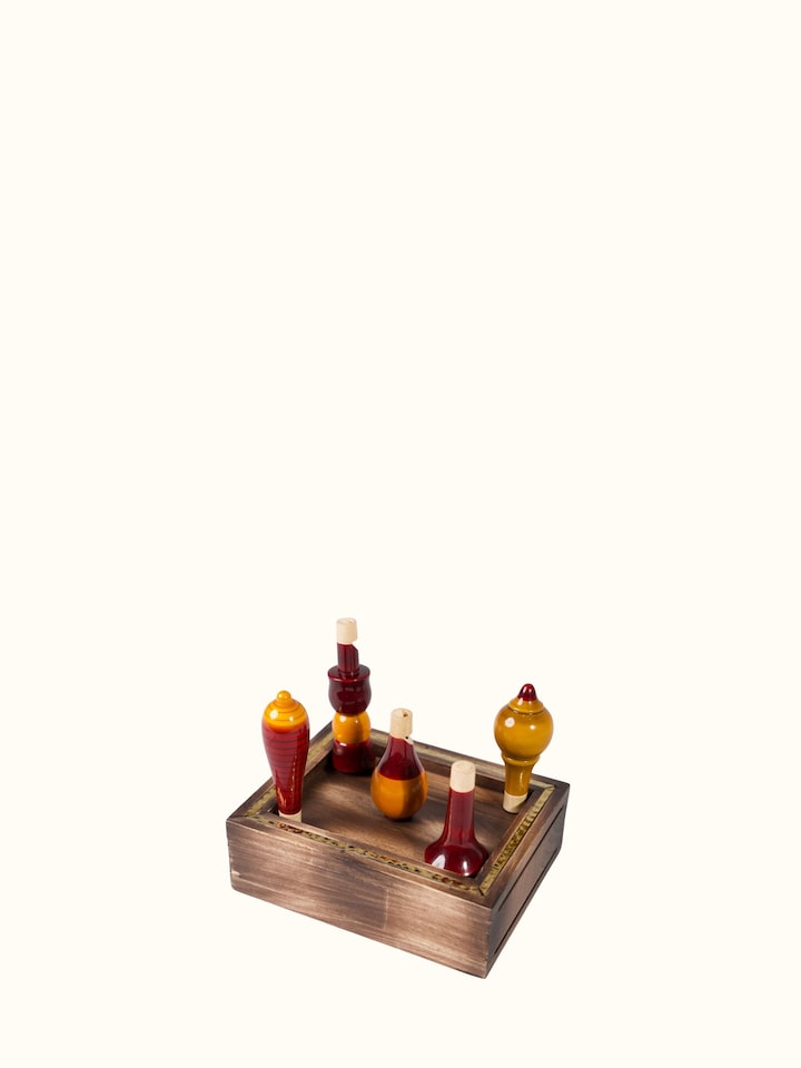 Angled view of Channapatna Wooden Whistles (5 Pcs)