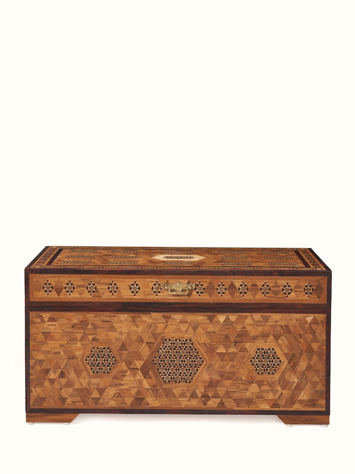 Front view of teak wood marquetry trunk with intricate inlaid designs, showcasing its elegant craftsmanship and detail.
