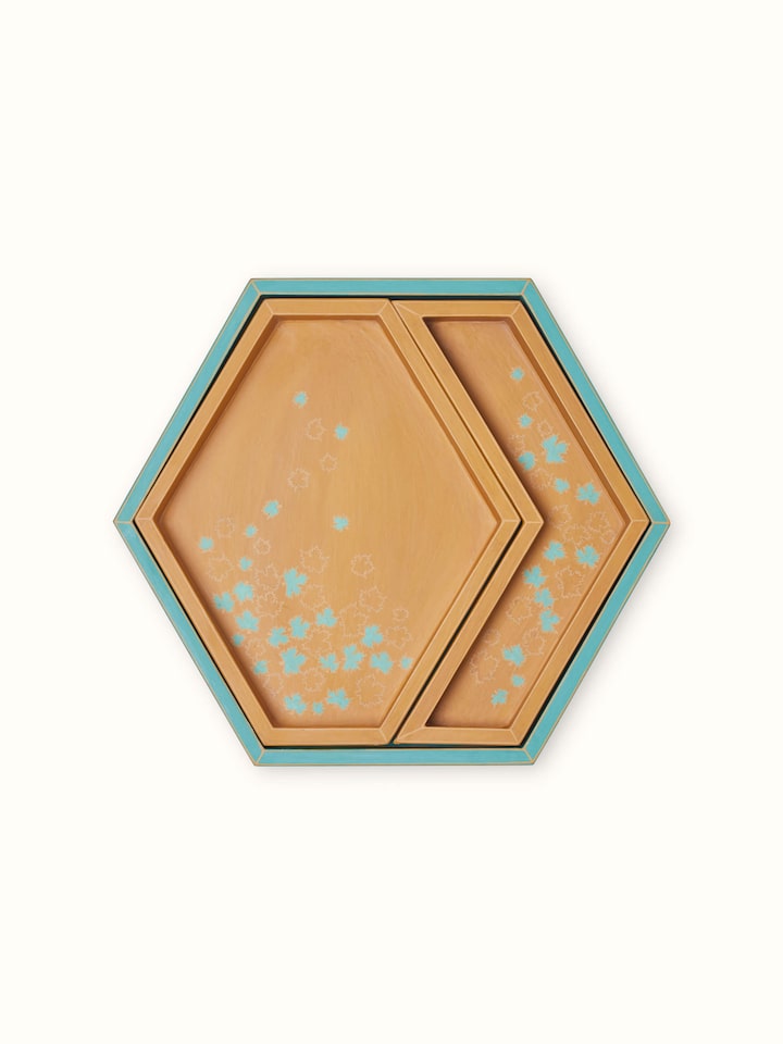 Detailed view of papier-mâché decorative tray, showcasing its vibrant colors and intricate design.