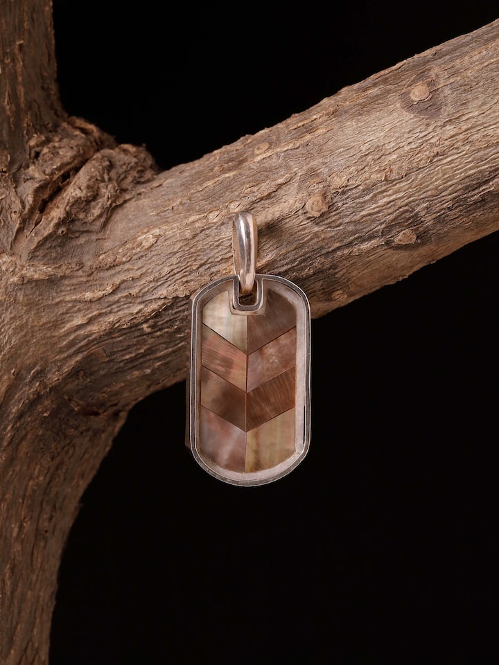 Styled detail view of Kutch Leather Silver Drop Earrings worn on the ear, shown in an alternate styled shot