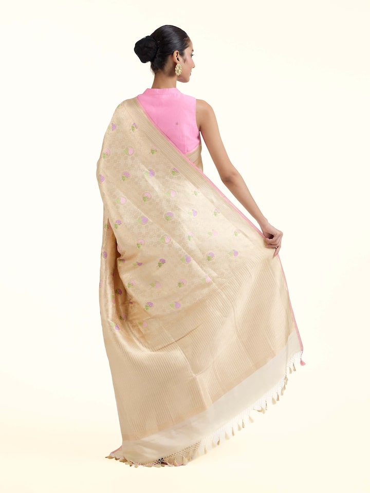 Back view of Off-white Banarasi Brocade Silk Saree emphasizing the overall design and fine details