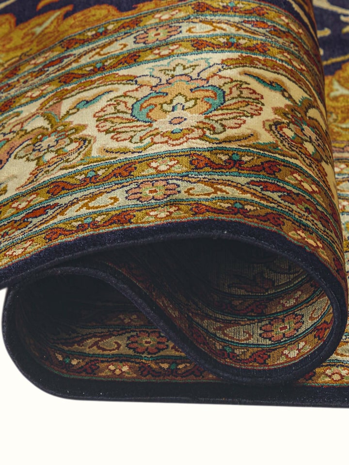 Detailed view of the Traditional Persian Navy Rust Isfahan Kashmir Silk Hand-Knotted Carpet craftsmanship