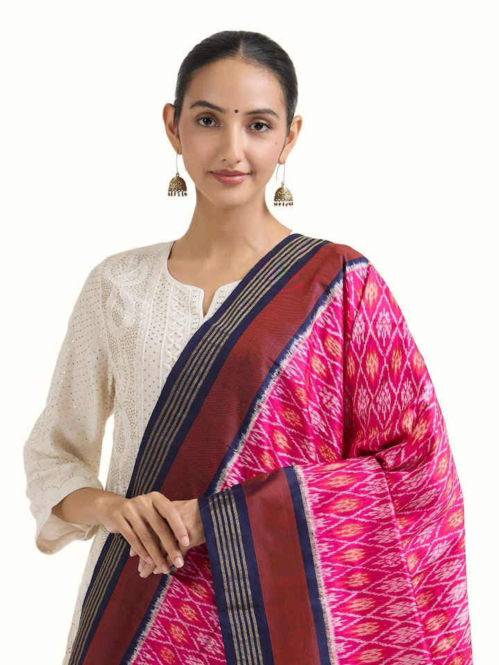 Angled view of pink and blue silk ikat zari dupatta highlighting ikat weave