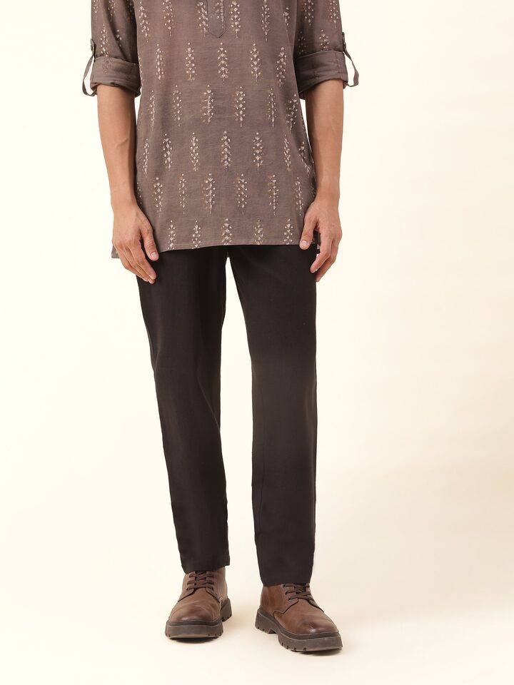 Front view highlighting the classic black hue and relaxed fit of these essential cotton pyjamas.