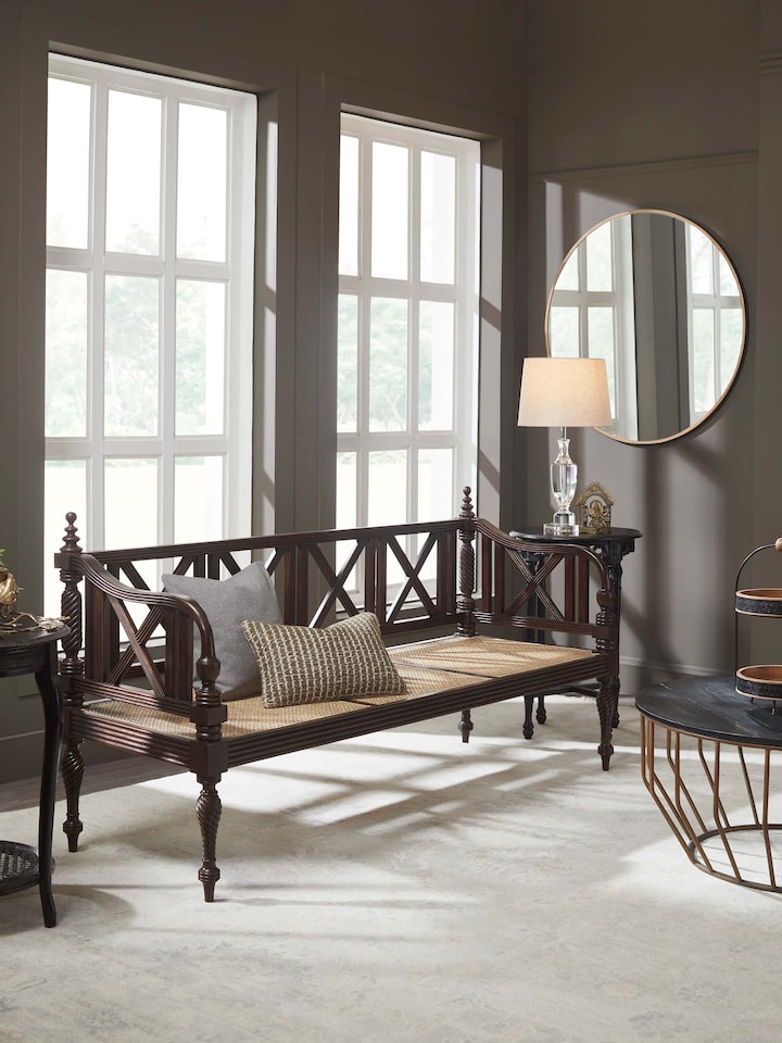 Side view of Walnut finish Mahogany wood and cane sofa showcasing premium finish and sturdy armrests