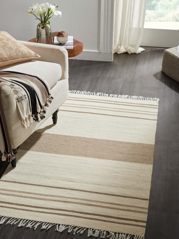 Close-up of Nomad Stripes Ivory Beige Jawaja wool & cotton handloom dhurrie showing the texture and stripe details.