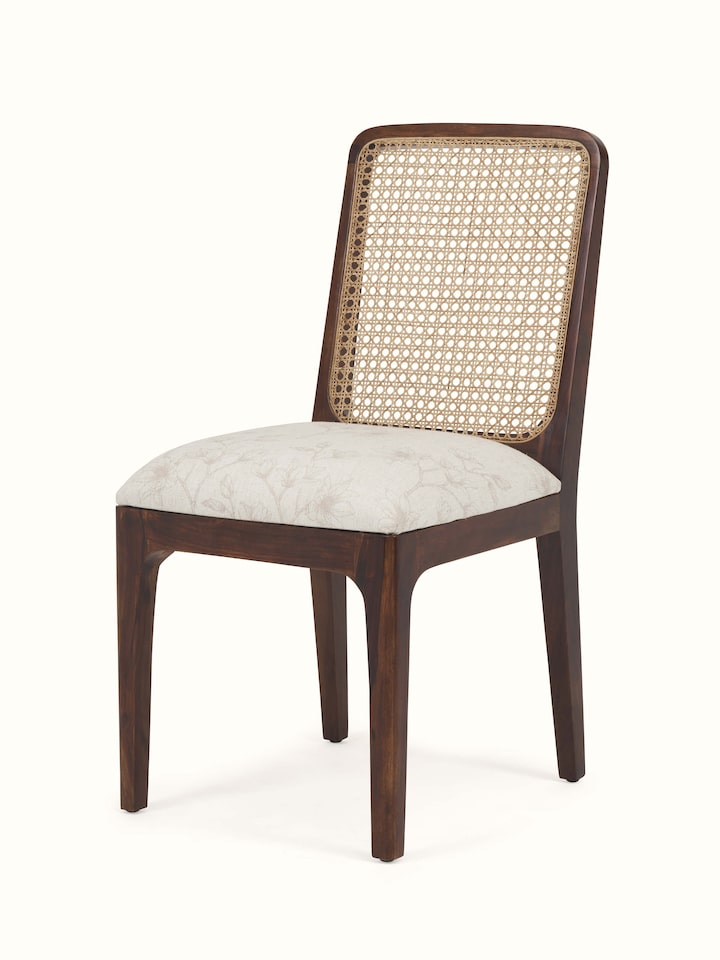 Angled view of Sheesham Wood & Cane Dining Chair emphasizing its high-quality sheesham wood frame and cane woven backrest.