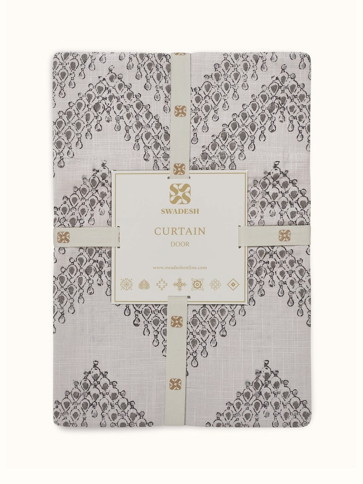 Fine detail of hem and stitch finish on modern grey cotton printed curtain