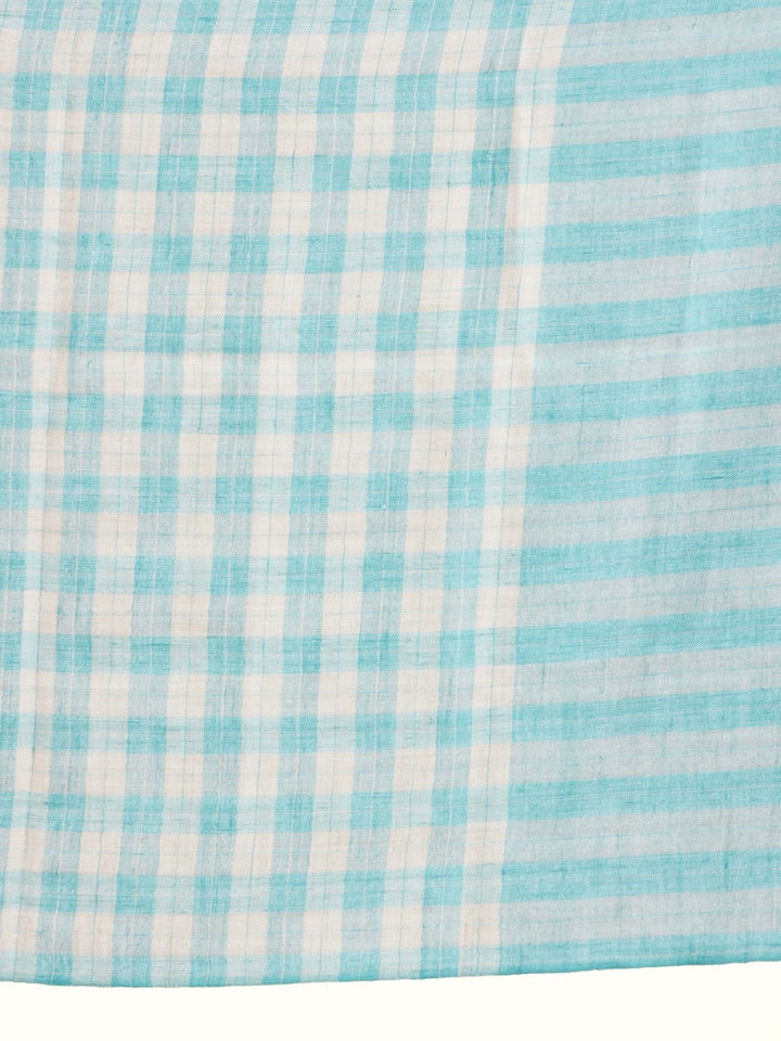 Detail view of aqua cashmere stole showing fabric and craftsmanship