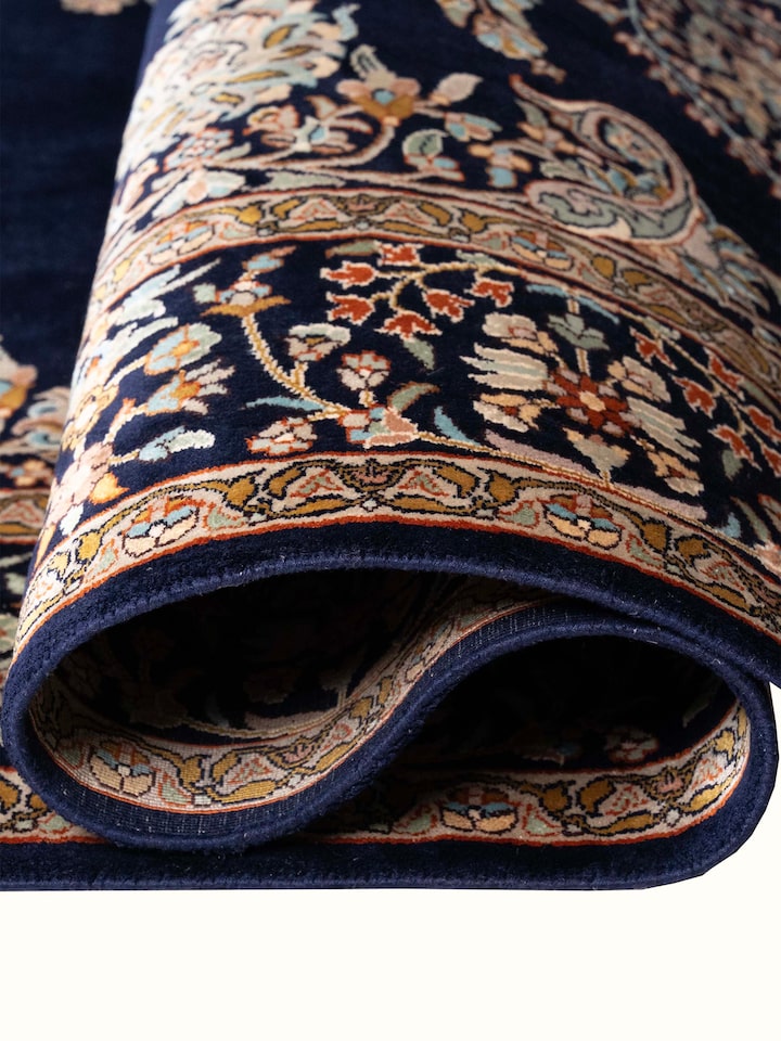 Detail view of Traditional Persian Navy Mahal Kashmir Silk Hand-Knotted Carpet highlighting the intricate pattern and pile texture, from a differen...