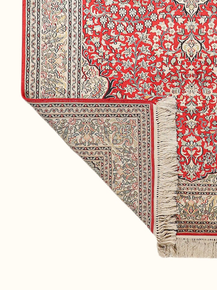 Side-angle view of the Traditional Persian Red Ivory Kashan Kashmir Silk Hand-Knotted Carpet