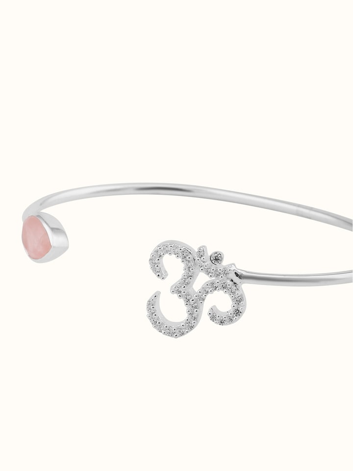 Overhead view of Rose Quartz & Om Bracelet, displaying its serene color palette and balanced design