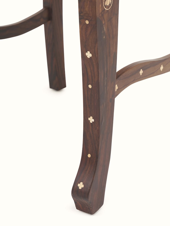 close-up view of upholstered rosewood inlay dining chair texture