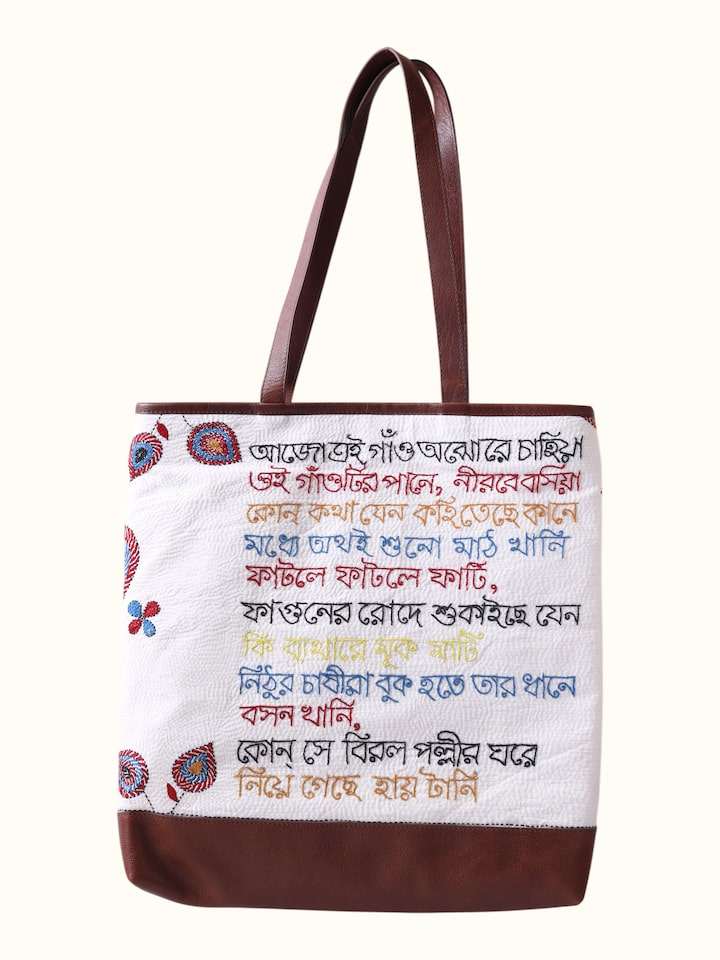 Front view of Kantha Embroidered Canvas Tote Bag showing the colourful printed text design