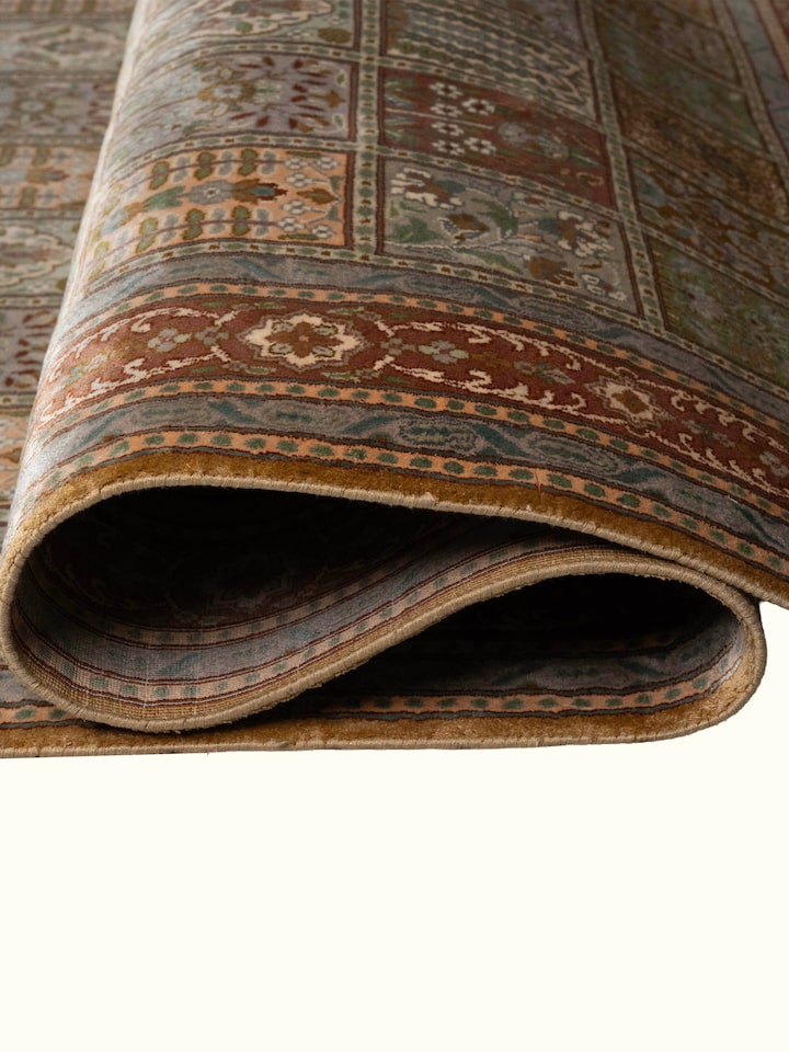 Detail view of Traditional Persian Green Dabdar Kashmir Silk Hand-Knotted Carpet highlighting the intricate pattern and pile texture