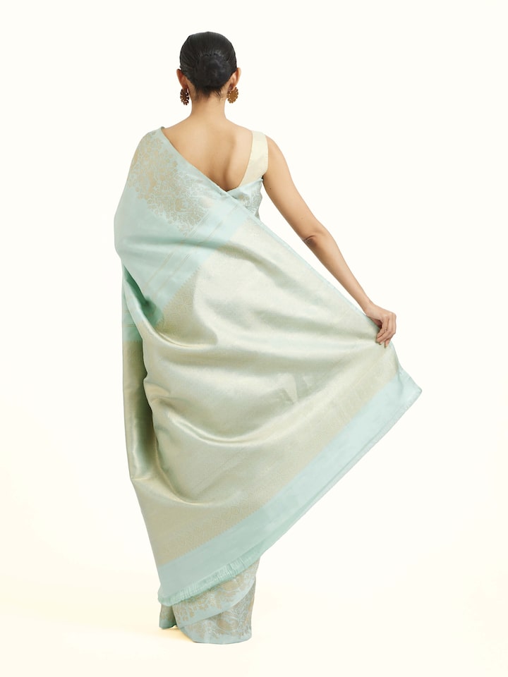 Back view of blue silk Kancheepuram saree displaying ornate pallu