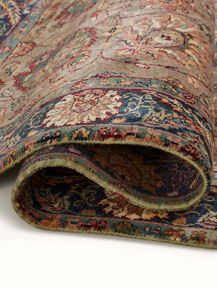 Detailed shot capturing the carpet’s border and motif intricacy