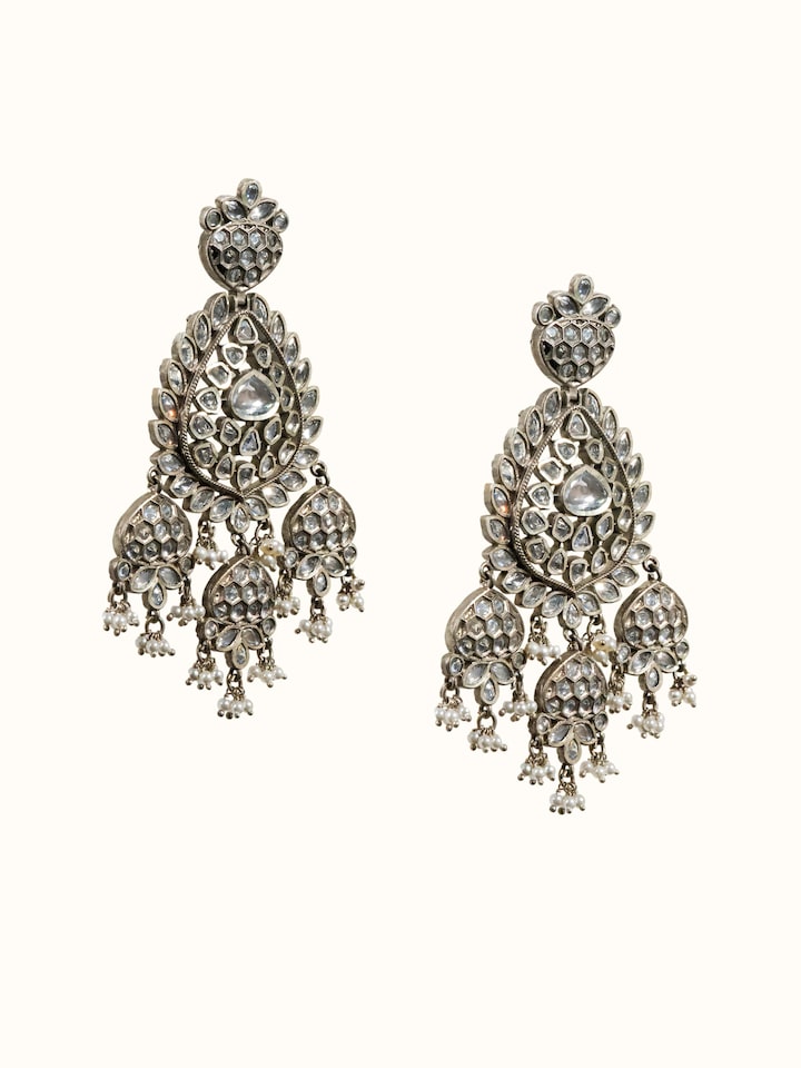 angled view of dank polki silver drop earrings