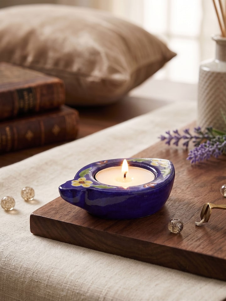 Styled view of Blue Pottery Ceramic Tea Light Holder styled in a home setting