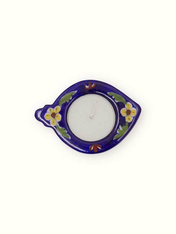 Handcrafted blue pottery ceramic tea light holder – side angle view