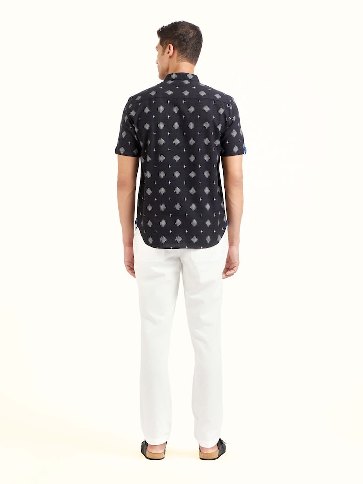 Back view of black cotton Telangana Ikat shirt displaying consistent pattern and neat finishing