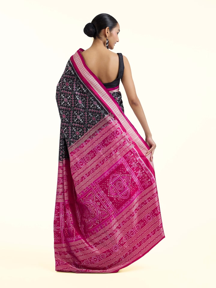 Back view of black mulberry silk Bandha Odisha Ikat saree displaying full design